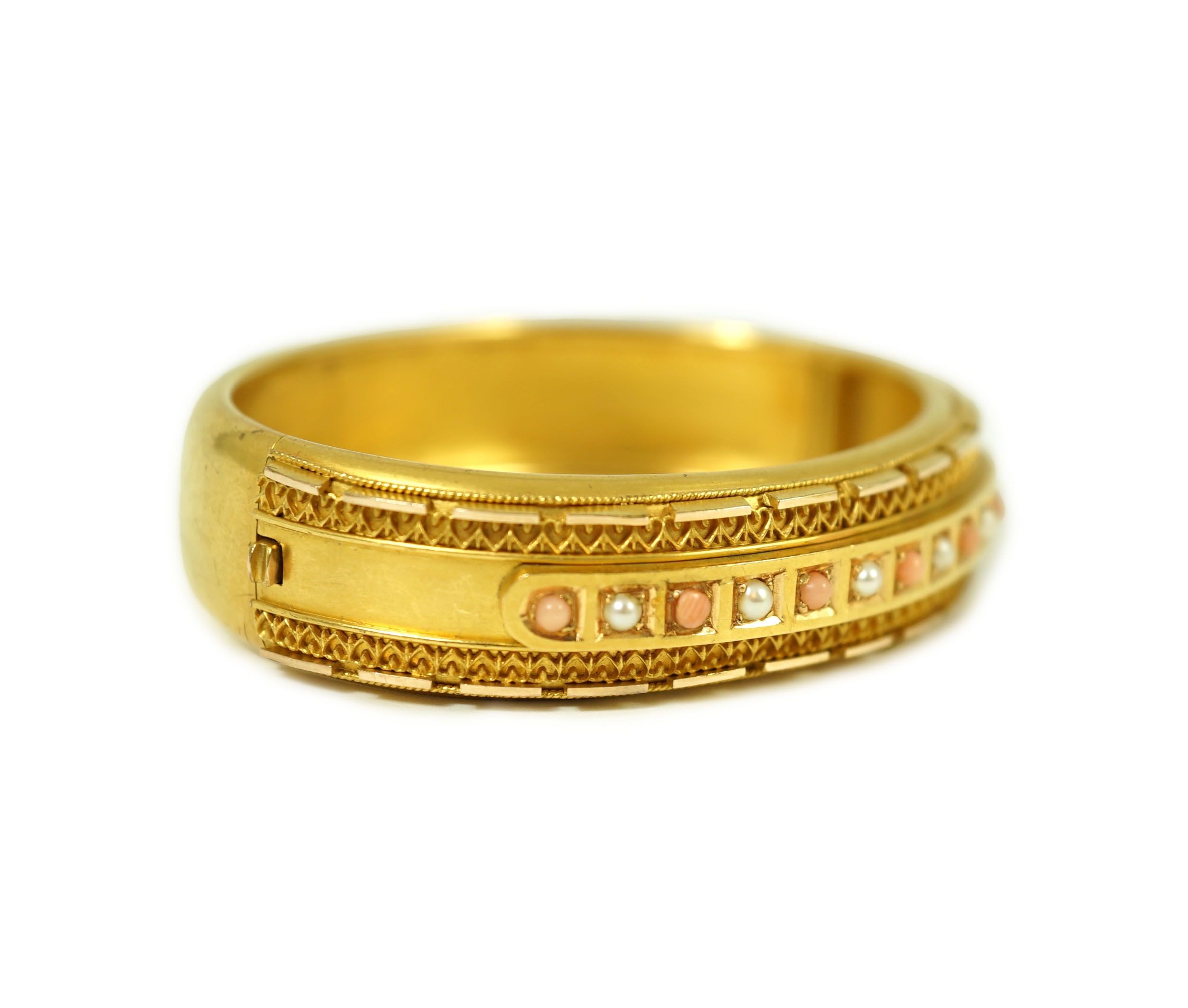 A late Victorian 15ct gold coral bead and seed pearl set part cannetile work hinged bangle